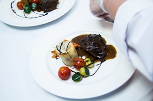 Students created menus and prepared the dishes for a five-course meal. The entree was beef bourguignon with a potato tower and vegetables.