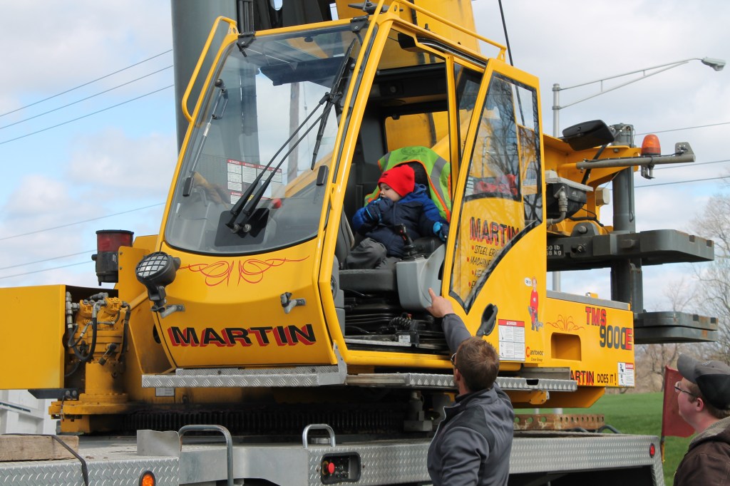 A child sits in a crane from 2013’s Touch-A-Truck event at Ivy Tech Community College Northeast.