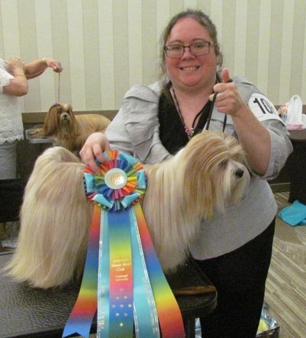 Rambo with Pippa at the Lhasa Apso National Specialty dog show in St.  Lous, Mo. Pippa had just received her Champion title ribbon.
