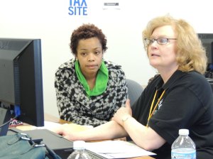 Ivy Tech Northeast accounting instructor Gail Amstutz (right) assists Fort Wayne resident Tameka Brown file her tax returns electronically. Amstutz is the College's site coordinator for the IRS-sponsored Volunteer Income Tax Assistance program, or VITA. 