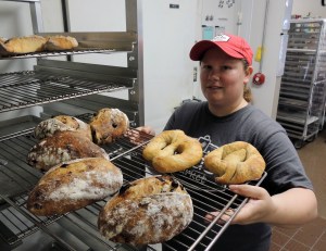 Hinton with loaves of bread and some sourdough bread pretzel tests.