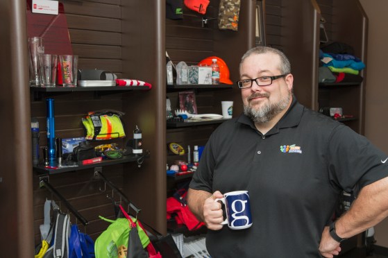 Davis invites local clients looking for customizable promotional items to visit his employer’s showroom at YourPromoPeople.com. Some of Davis’ most notable work involves swag for country music stars, including the Garth Brooks mug he’s holding—a design that required personal approval from Brooks.