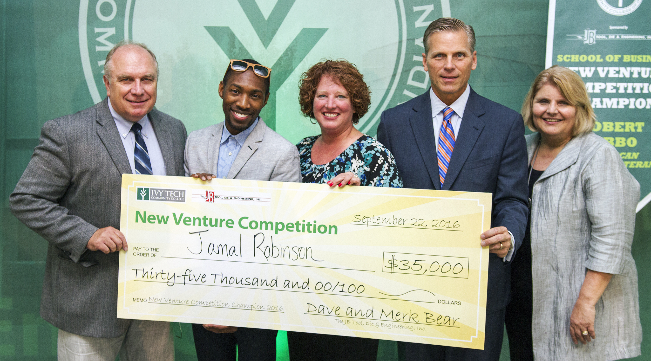 Jamal Robinson won $35,000 on Thursday night at Ivy Tech Northeast’s 2016 New Venture Competition, in its sixth year. Robinson is the founder of DESIAR Eyewear. From left: James Tolbert, Ivy Tech Northeast business administration assistant professor; Robinson; Doug Wood, PNC Bank regional president; Karen Potter, ProFed Credit Union assistant vice president, commercial services; and Jerrilee K. Mosier, Ivy Tech Northeast chancellor.