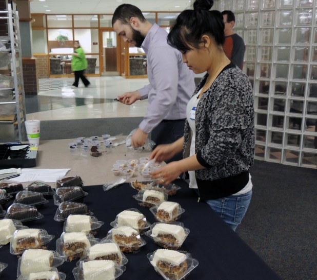 Kyle Hyland and Hay Maung, Case Problems in Business students, package samples of chocolate and carrot cake in Crescent Commons.